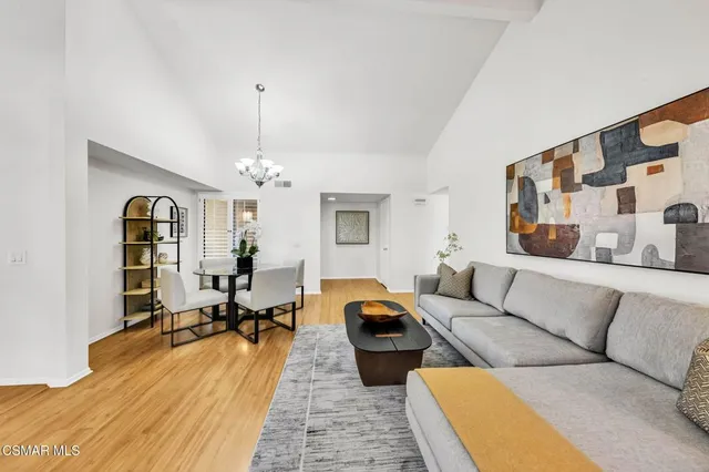 a living room with furniture fireplace and window