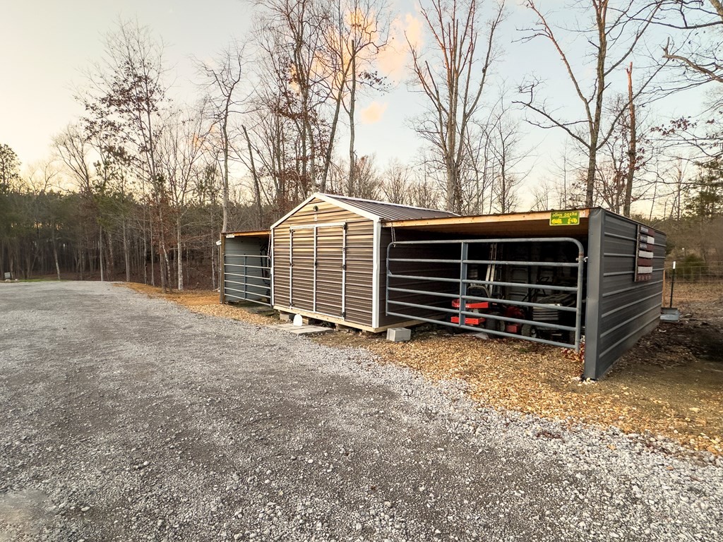 3145 Mt Pleasant Road Dalton, GA 30721 - Photo 21 of 29 a view of backyard with wooden fence and a large tree