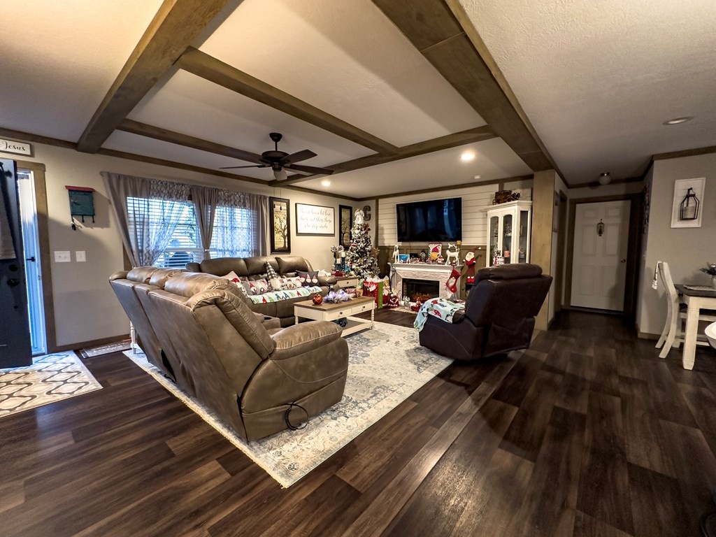 3145 Mt Pleasant Road Dalton, GA 30721 - Photo 7 of 29 a living room with furniture kitchen view and a wooden floor