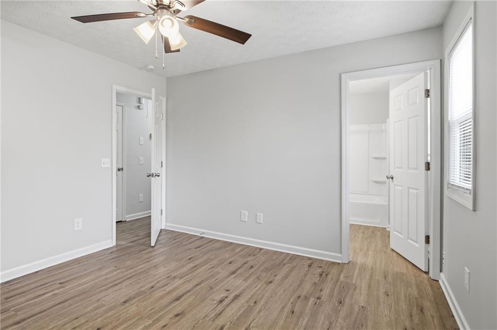 741 Roscoe Davis Road Monroe, GA 30656 - Photo 19 of 28 a view of an empty room with wooden floor