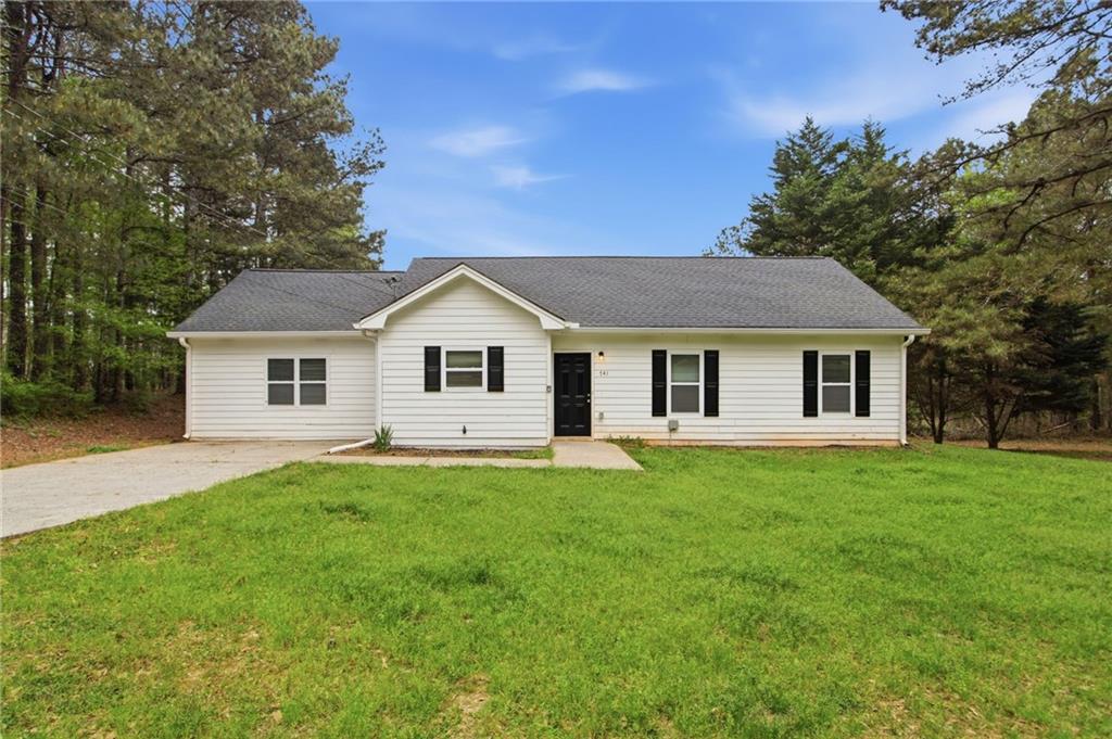 741 Roscoe Davis Road Monroe, GA 30656 - Photo 2 of 28 a view of a house and a yard with green space