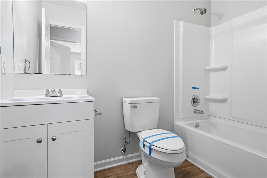 741 Roscoe Davis Road Monroe, GA 30656 - Photo 21 of 28 a bathroom with a sink toilet and shower