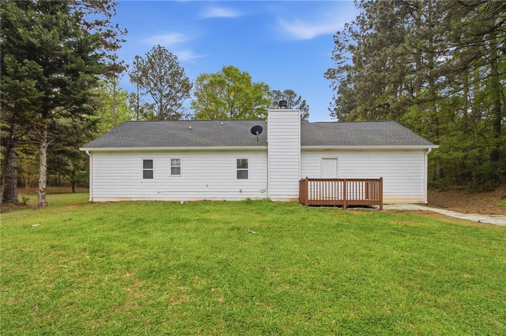 741 Roscoe Davis Road Monroe, GA 30656 - Photo 25 of 28 a view of a house with a backyard