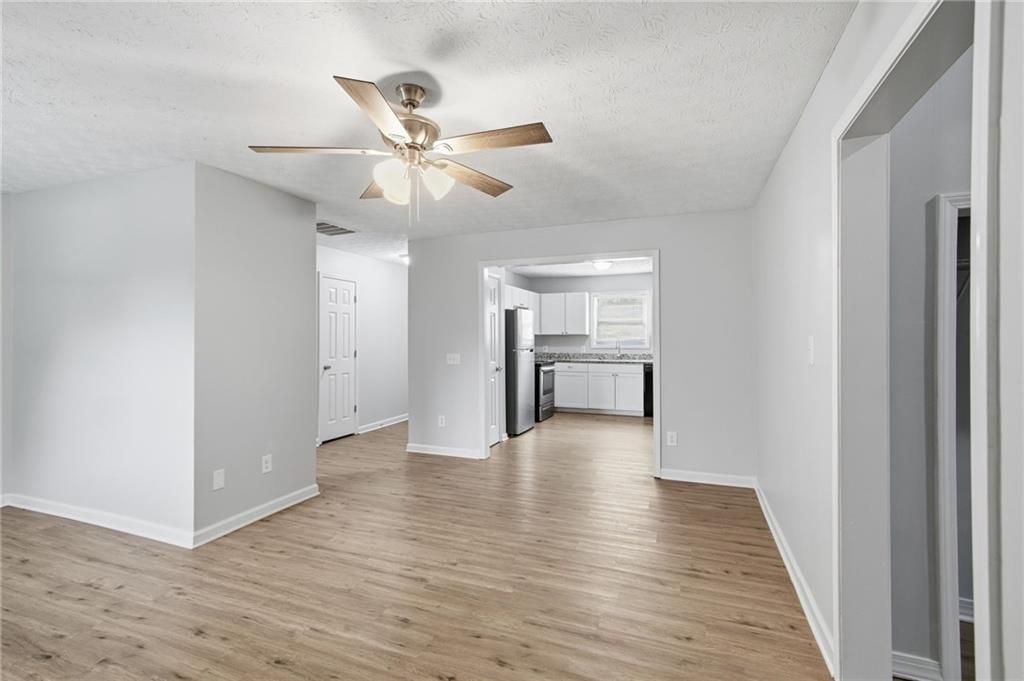 741 Roscoe Davis Road Monroe, GA 30656 - Photo 6 of 28 a view of an empty room with wooden floor