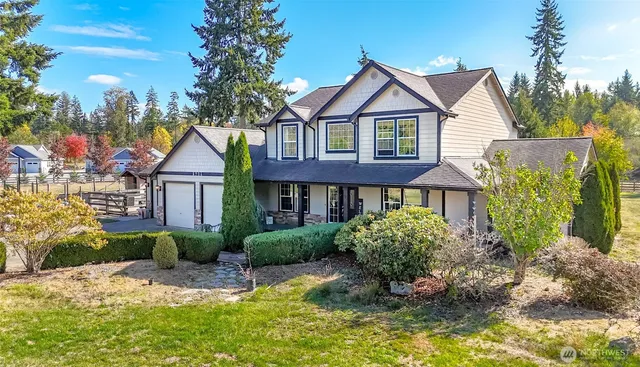a view of a house with a yard and plants