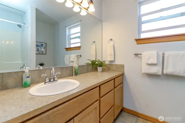 a bathroom with a sink and a mirror