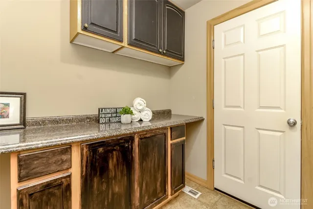 a view of cabinets and wooden floor