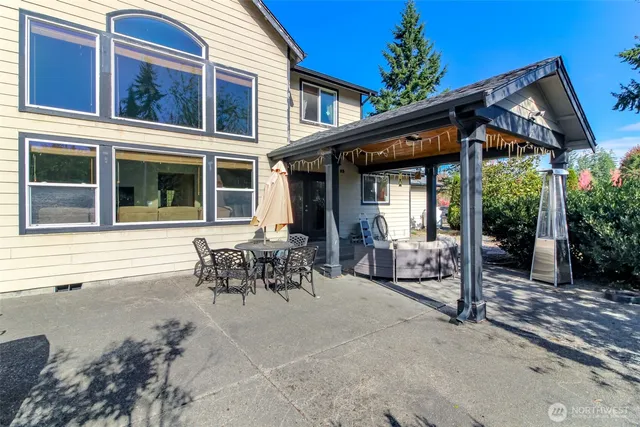 a patio with table and chairs