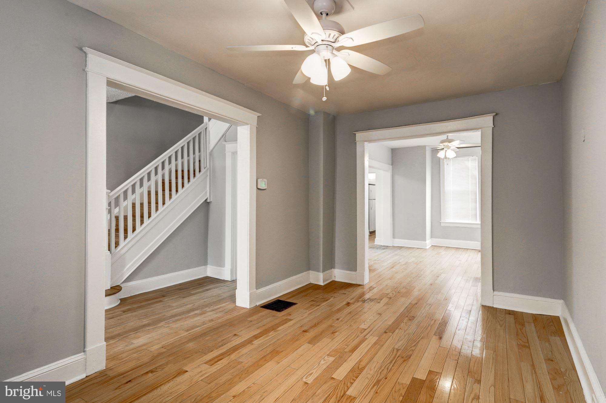 1016 North Rosedale Street Baltimore, MD 21216 - Photo 12 of 58 a view of a hallway with wooden floor and closet