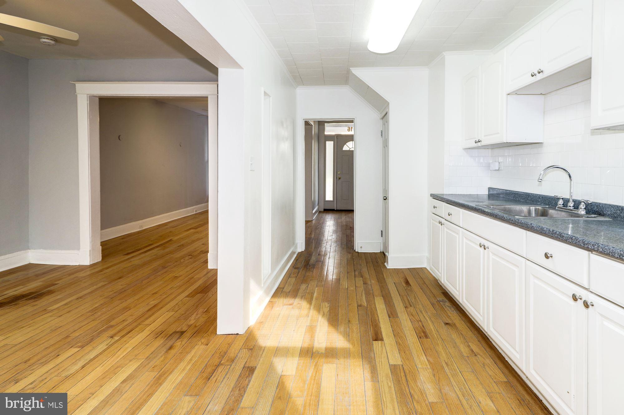 1016 North Rosedale Street Baltimore, MD 21216 - Photo 20 of 58 a view of a kitchen from the hallway