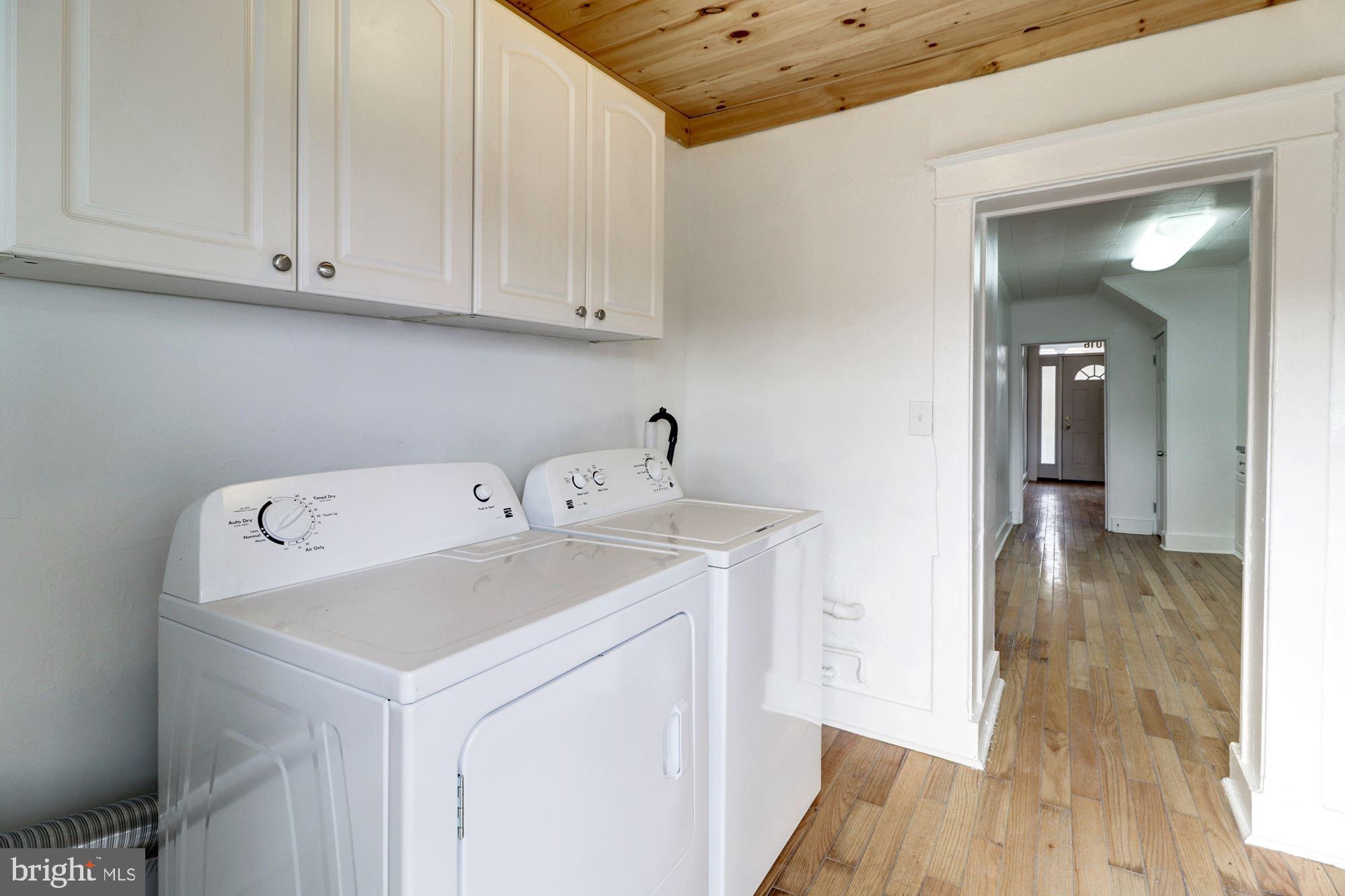1016 North Rosedale Street Baltimore, MD 21216 - Photo 23 of 58 a utility room with wooden floor washer and dryer