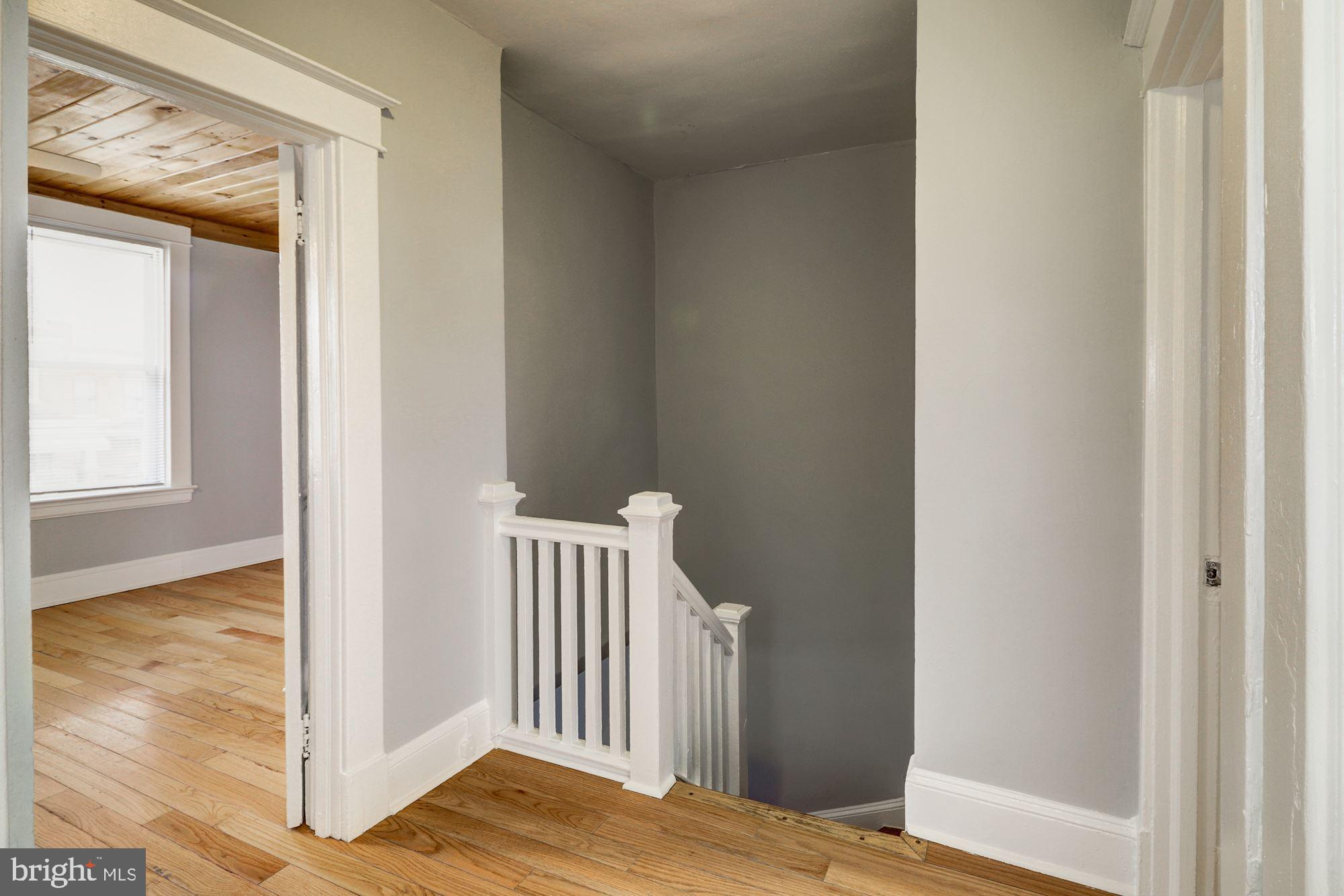1016 North Rosedale Street Baltimore, MD 21216 - Photo 26 of 58 a view of a bedroom from a hallway
