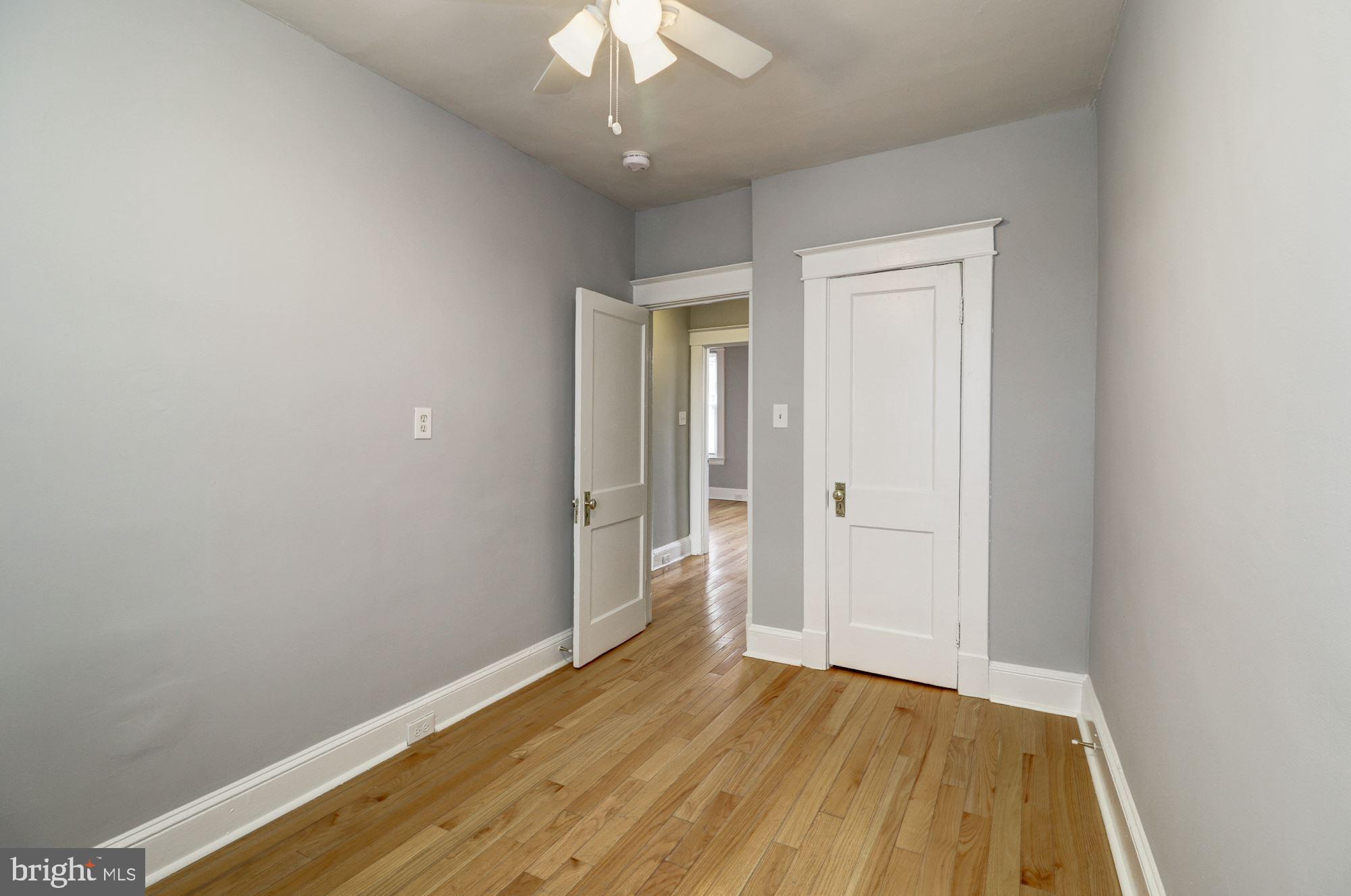 1016 North Rosedale Street Baltimore, MD 21216 - Photo 29 of 58 a view of an empty room with wooden floor
