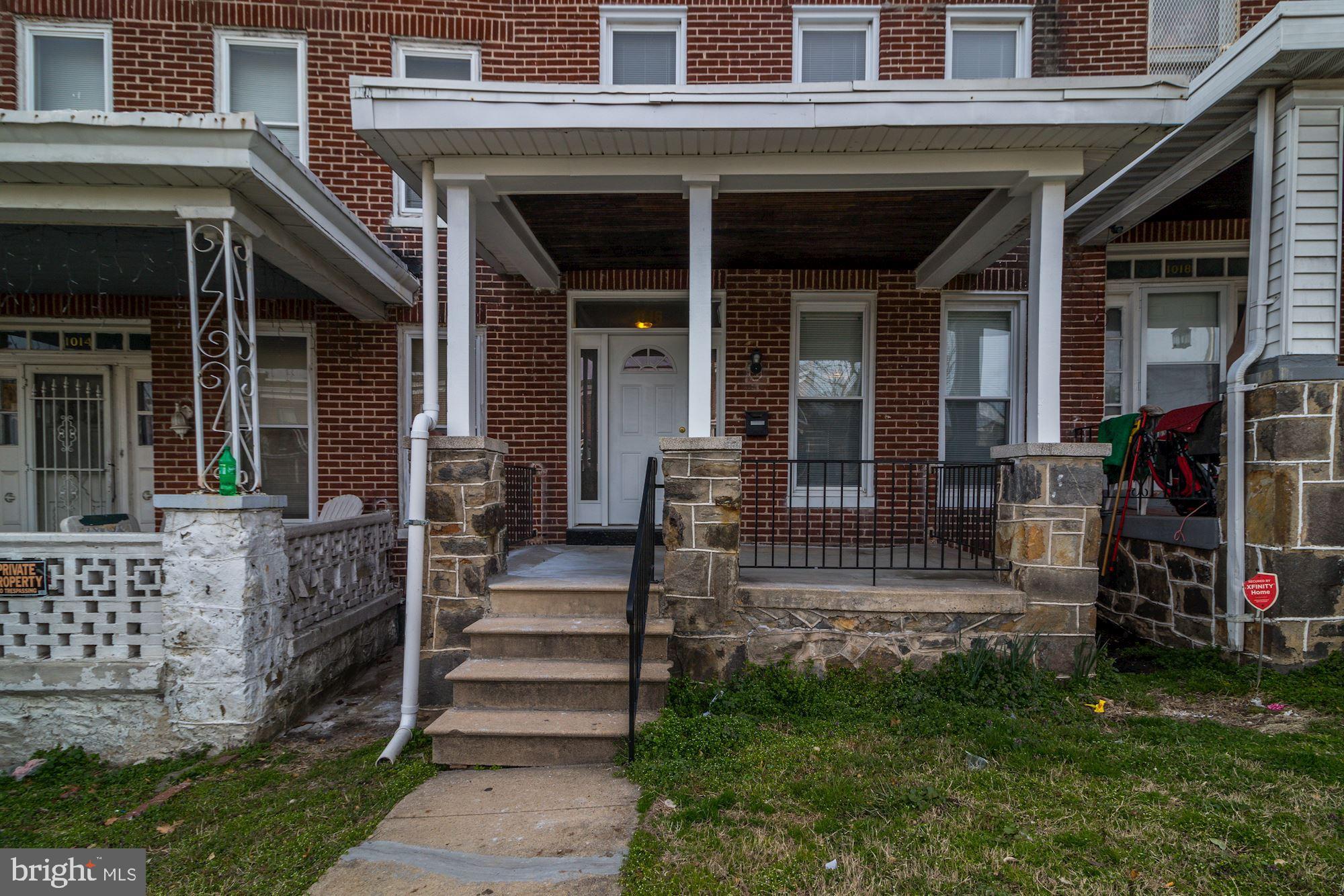 1016 North Rosedale Street Baltimore, MD 21216 - Photo 4 of 58 a view of a house with a porch and a bench