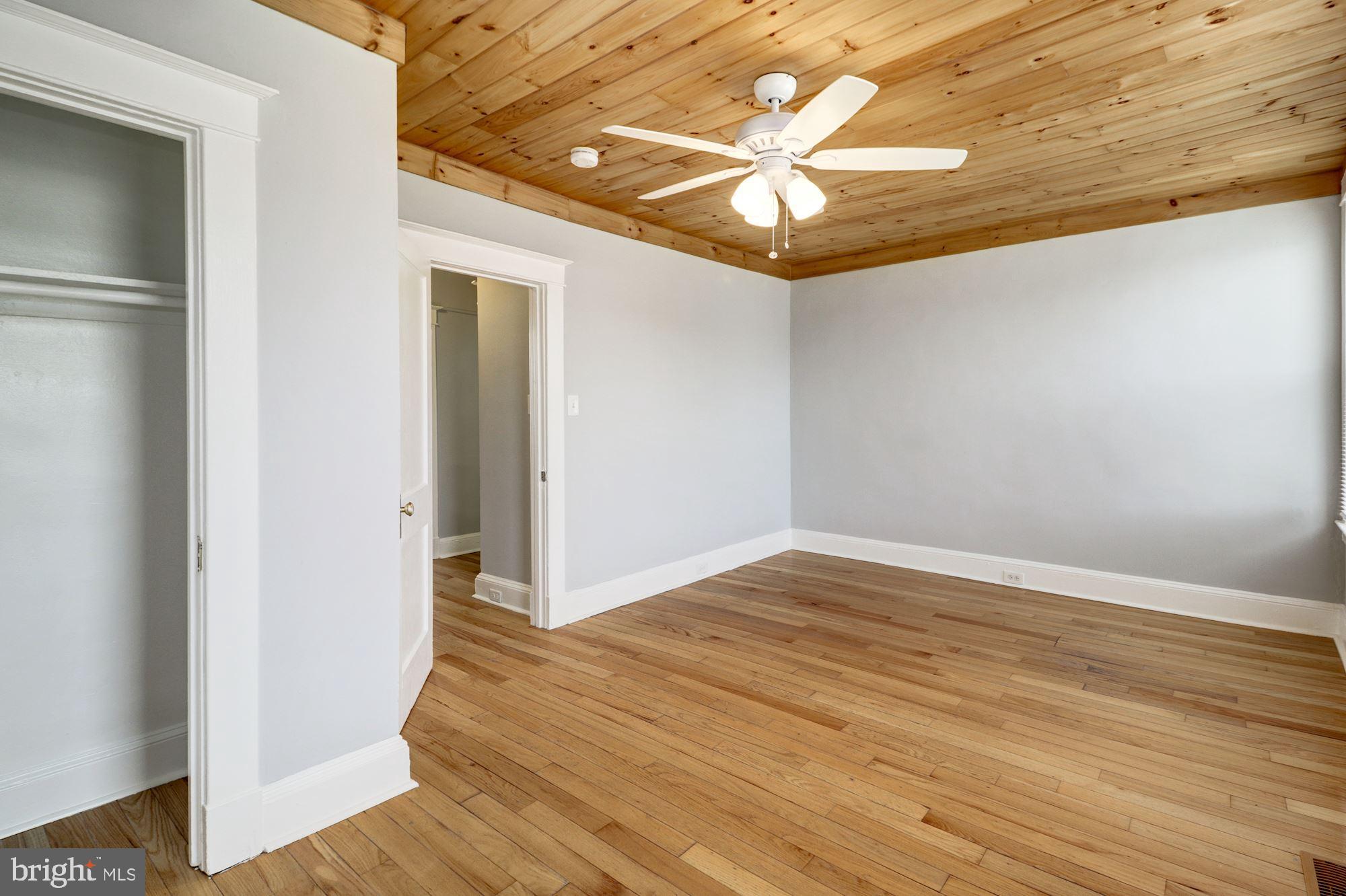 1016 North Rosedale Street Baltimore, MD 21216 - Photo 33 of 58 a view of an empty room with wooden floor and a window