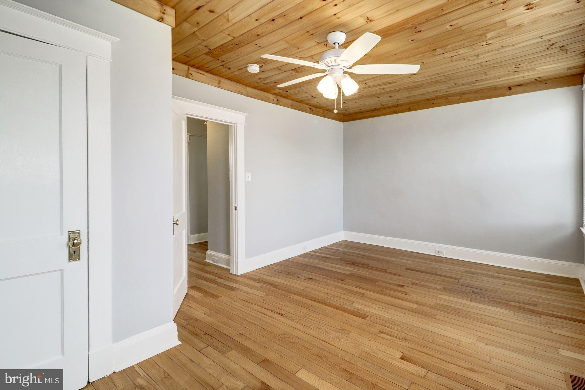 1016 North Rosedale Street Baltimore, MD 21216 - Photo 34 of 58 a view of an empty room with wooden floor
