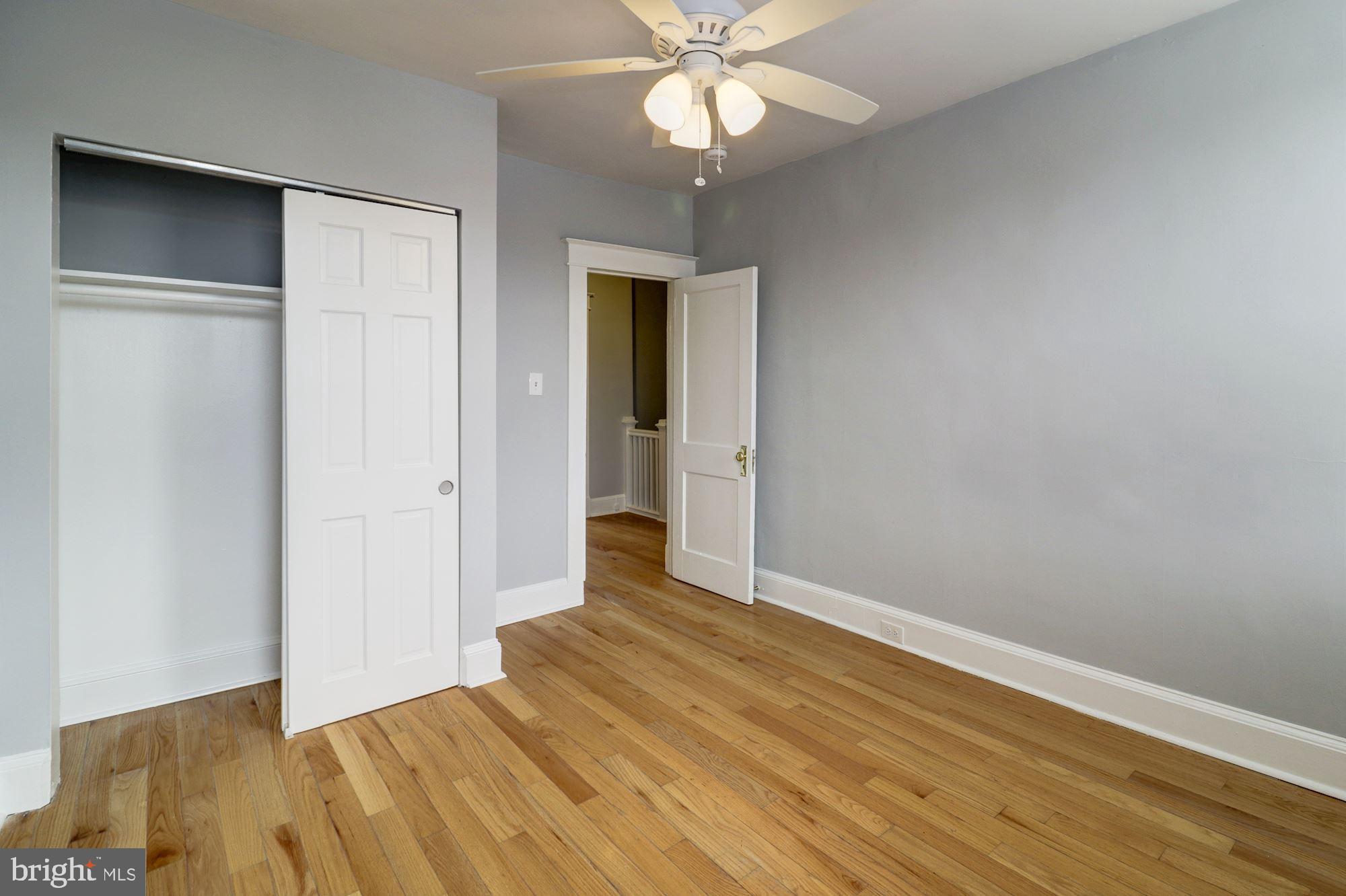 1016 North Rosedale Street Baltimore, MD 21216 - Photo 41 of 58 a view of an empty room with wooden floor