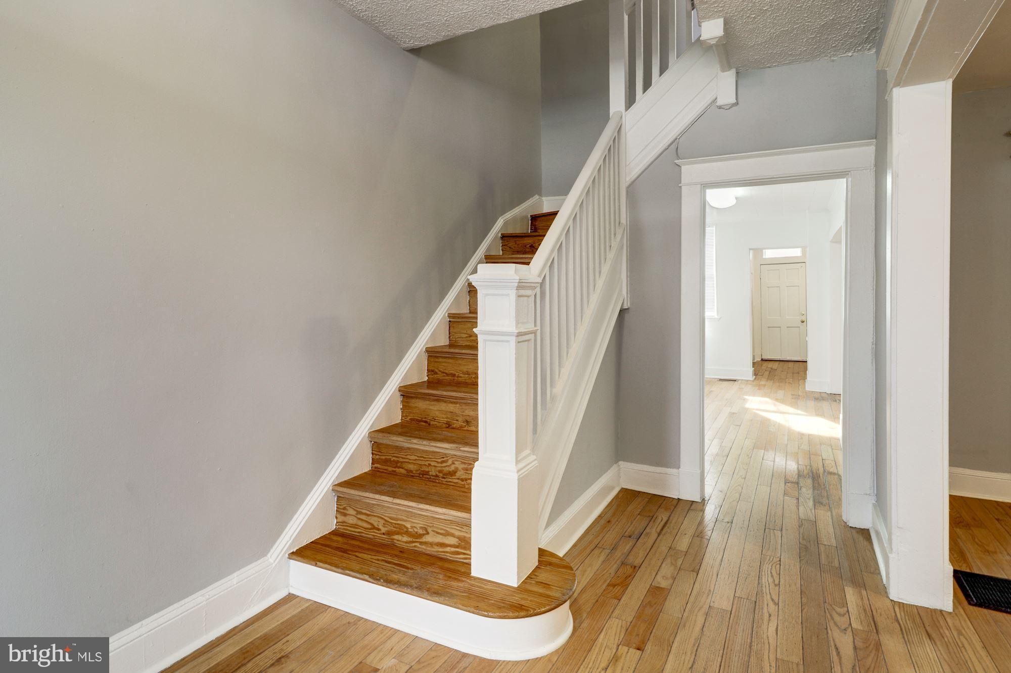 1016 North Rosedale Street Baltimore, MD 21216 - Photo 8 of 58 a view of entryway and hall with wooden floor