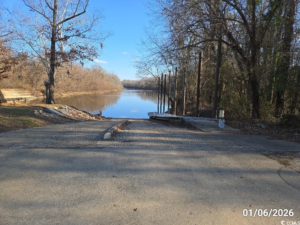 1341 Allison Landing Road Johnsonville, SC 29555 - Photo 5 of 27 Water view with a boat ramp and a heavily wooded area