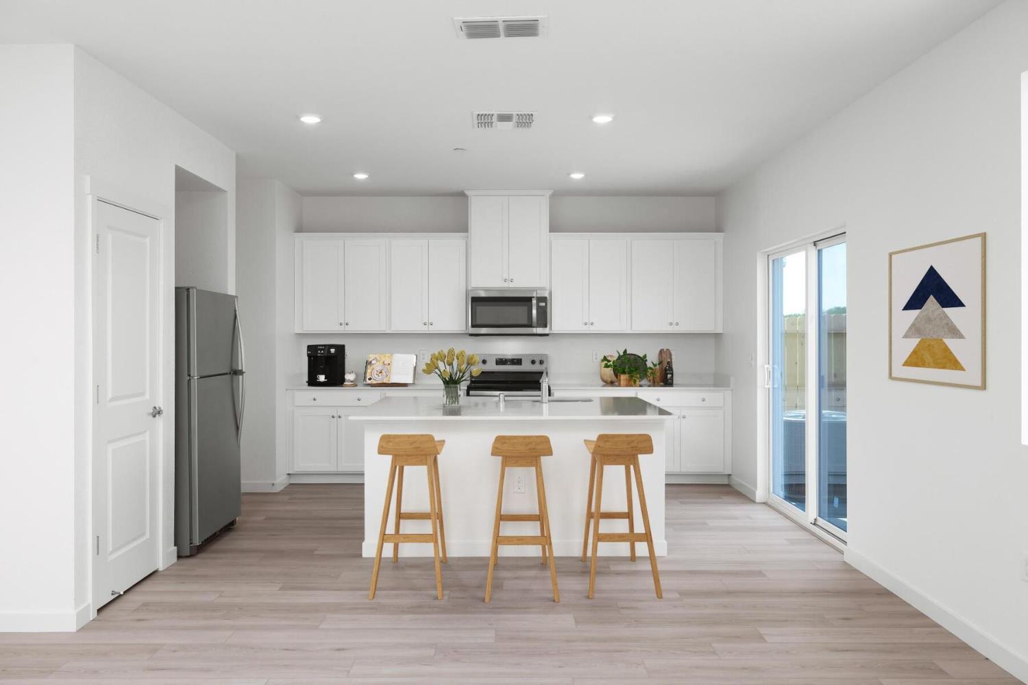 821 Helmsley Lane Patterson, CA 95363 - Photo 4 of 21 a kitchen with stainless steel appliances granite countertop a refrigerator a stove top oven a sink and cabinets