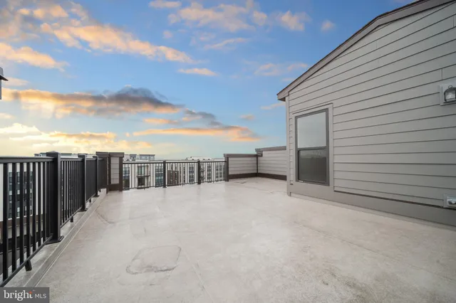 a view of an empty room with white walls