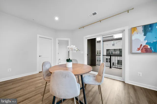 a kitchen with stainless steel appliances a refrigerator and a stove top oven