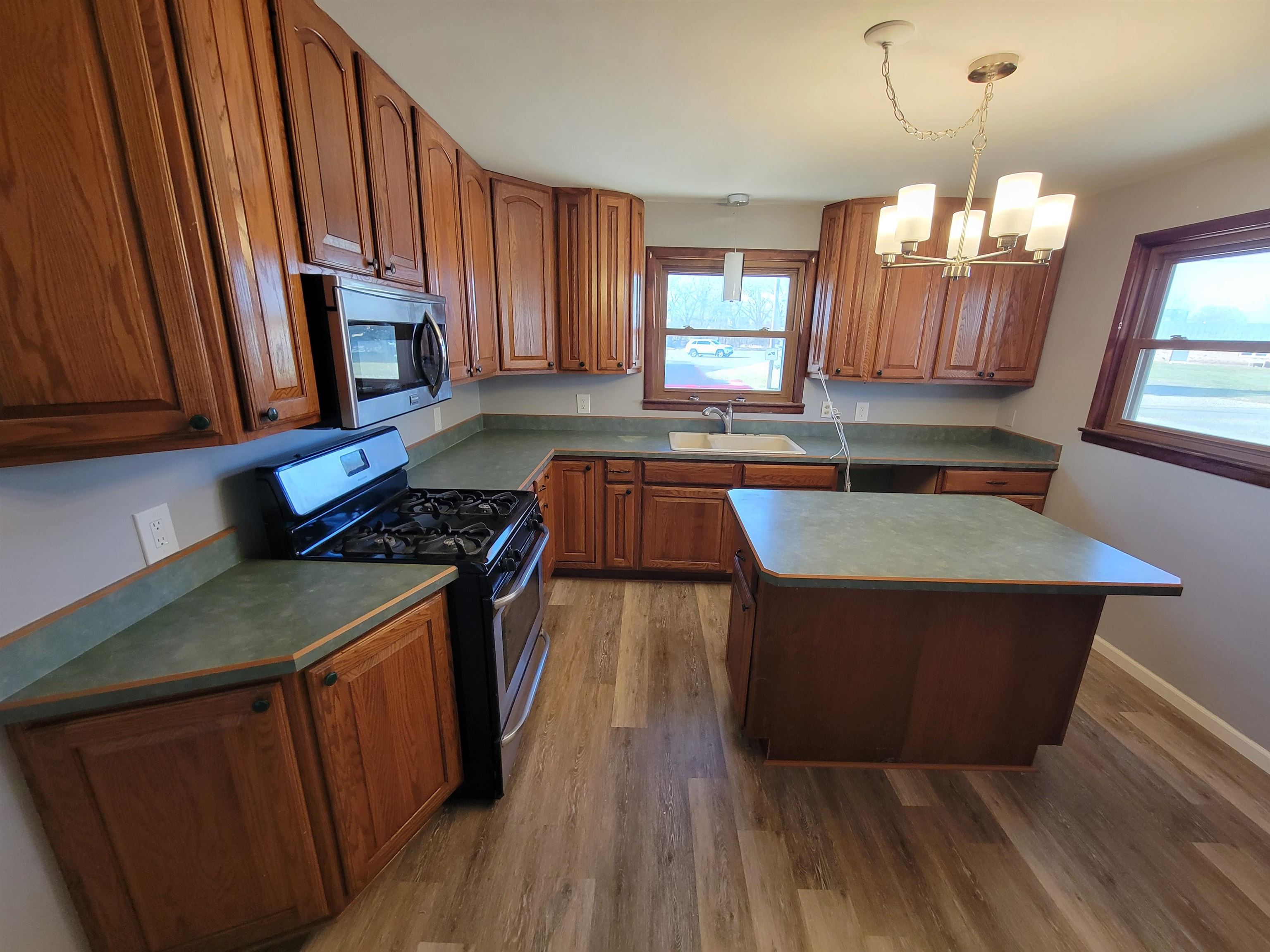 1352 Chartres Street LaSalle, IL 61301 - Photo 6 of 32 a kitchen with granite countertop a sink a counter space appliances and cabinets