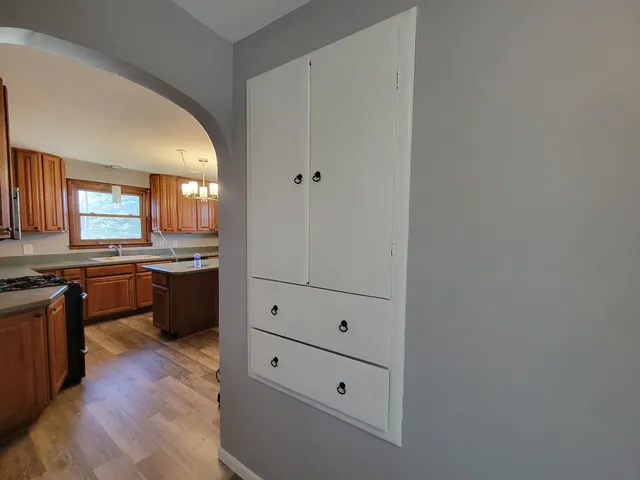 a view of kitchen with wooden floor