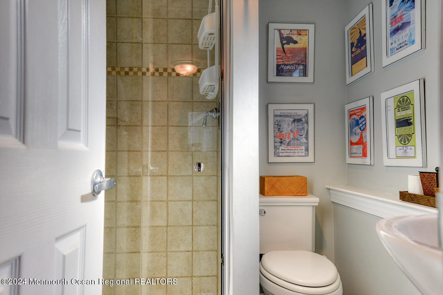 105 St Louis Avenue Point Pleasant Beach, NJ 08742 - Photo 11 of 25 a white toilet sitting next to a bathroom sink