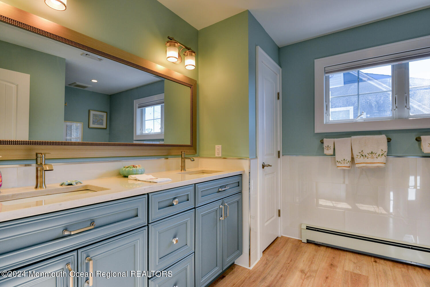 105 St Louis Avenue Point Pleasant Beach, NJ 08742 - Photo 15 of 25 a bathroom with a sink a vanity and a mirror