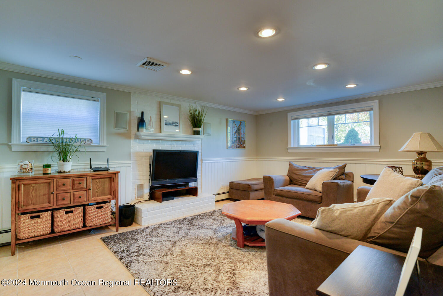 105 St Louis Avenue Point Pleasant Beach, NJ 08742 - Photo 22 of 25 a living room with furniture a flat screen tv and a fireplace