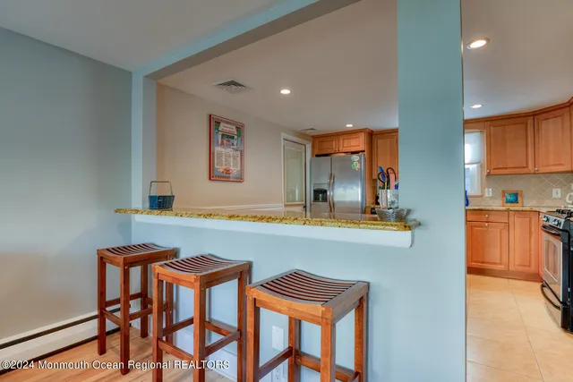 a kitchen with a table and chairs in it