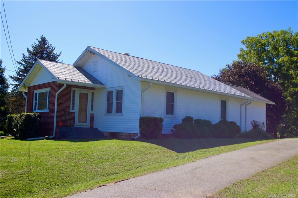 451 Possum Ridge Road Canton, NC 28716 - Photo 1 of 44 a house view with a garden space