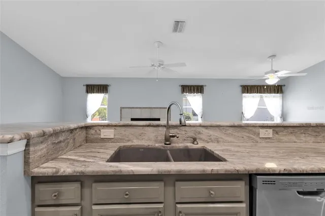 a kitchen with a sink and stove