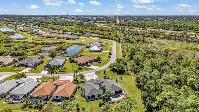 an aerial view of residential houses with outdoor space