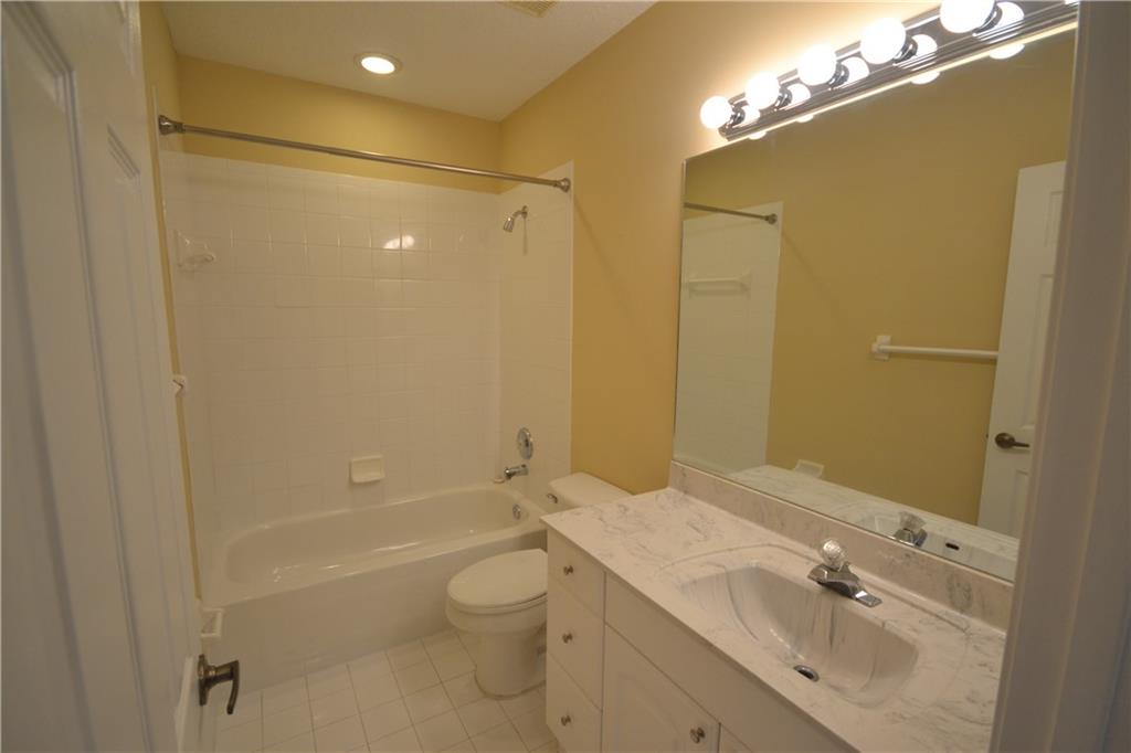 2809 Frederick Boulevard Delray Beach, FL 33483 - Photo 12 of 18 a bathroom with a sink a toilet and shower