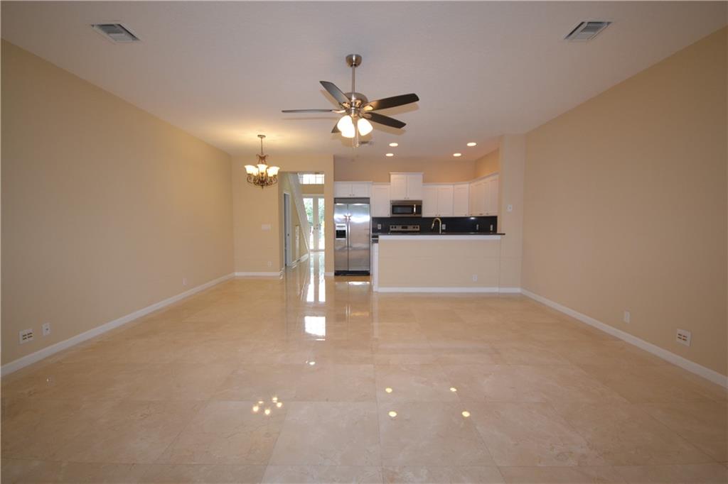 2809 Frederick Boulevard Delray Beach, FL 33483 - Photo 6 of 18 a view of a kitchen with a sink and a refrigerator