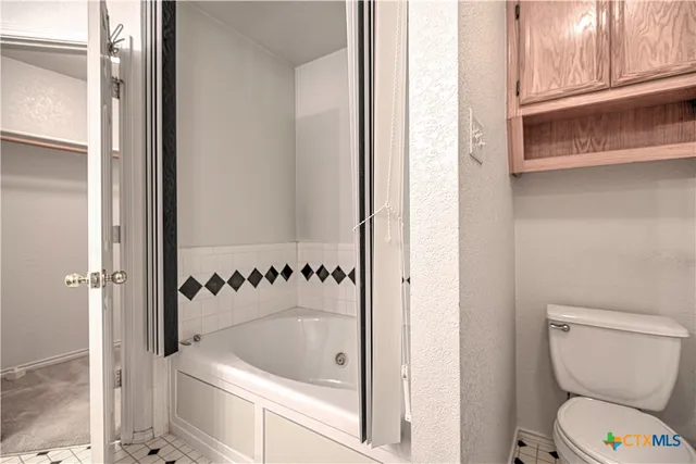 a bathroom with a toilet and a sink