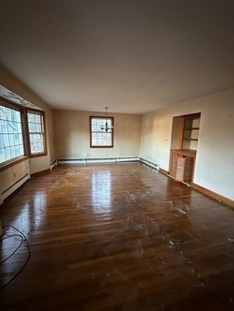 46 Mason Road Townsend, MA 01474 - Photo 7 of 15 a view of an empty room with window and wooden floor