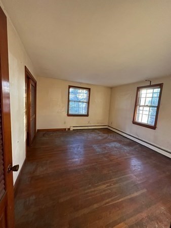 46 Mason Road Townsend, MA 01474 - Photo 8 of 15 an empty room with wooden floor and windows