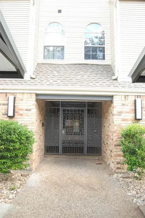 a view of a house with large windows