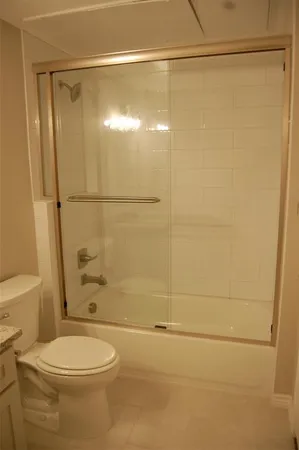 a bathroom with a toilet and shower