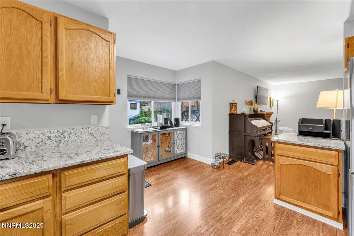 10245 Ferret Circle Reno, NV 89523 - Photo 8 of 31 a kitchen with sink refrigerator and cabinets