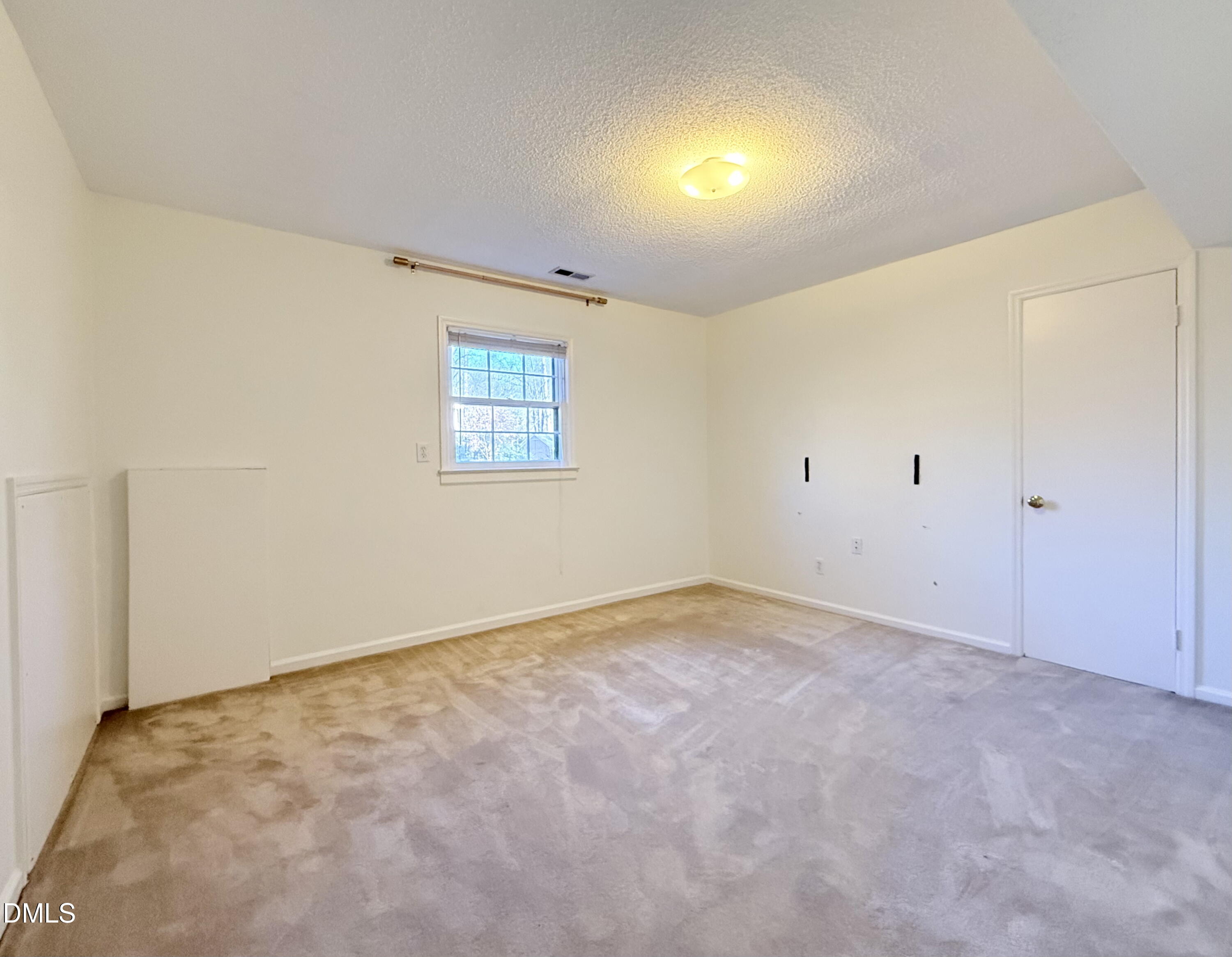 702 Delmar Road Cary, NC 27511 - Photo 19 of 23 an empty room with windows