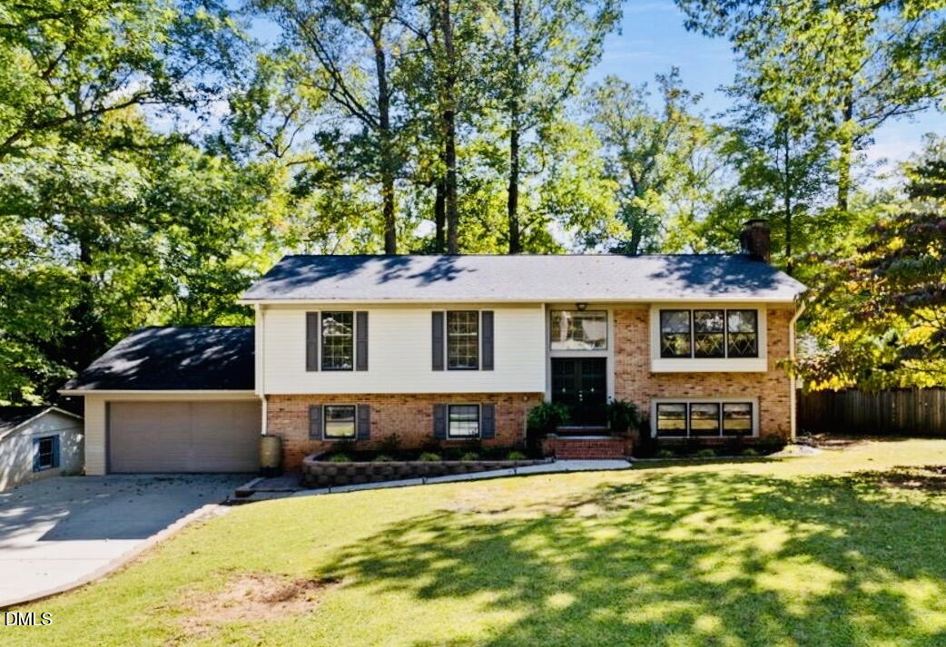 702 Delmar Road Cary, NC 27511 - Photo 2 of 23 front view of a house with a yard