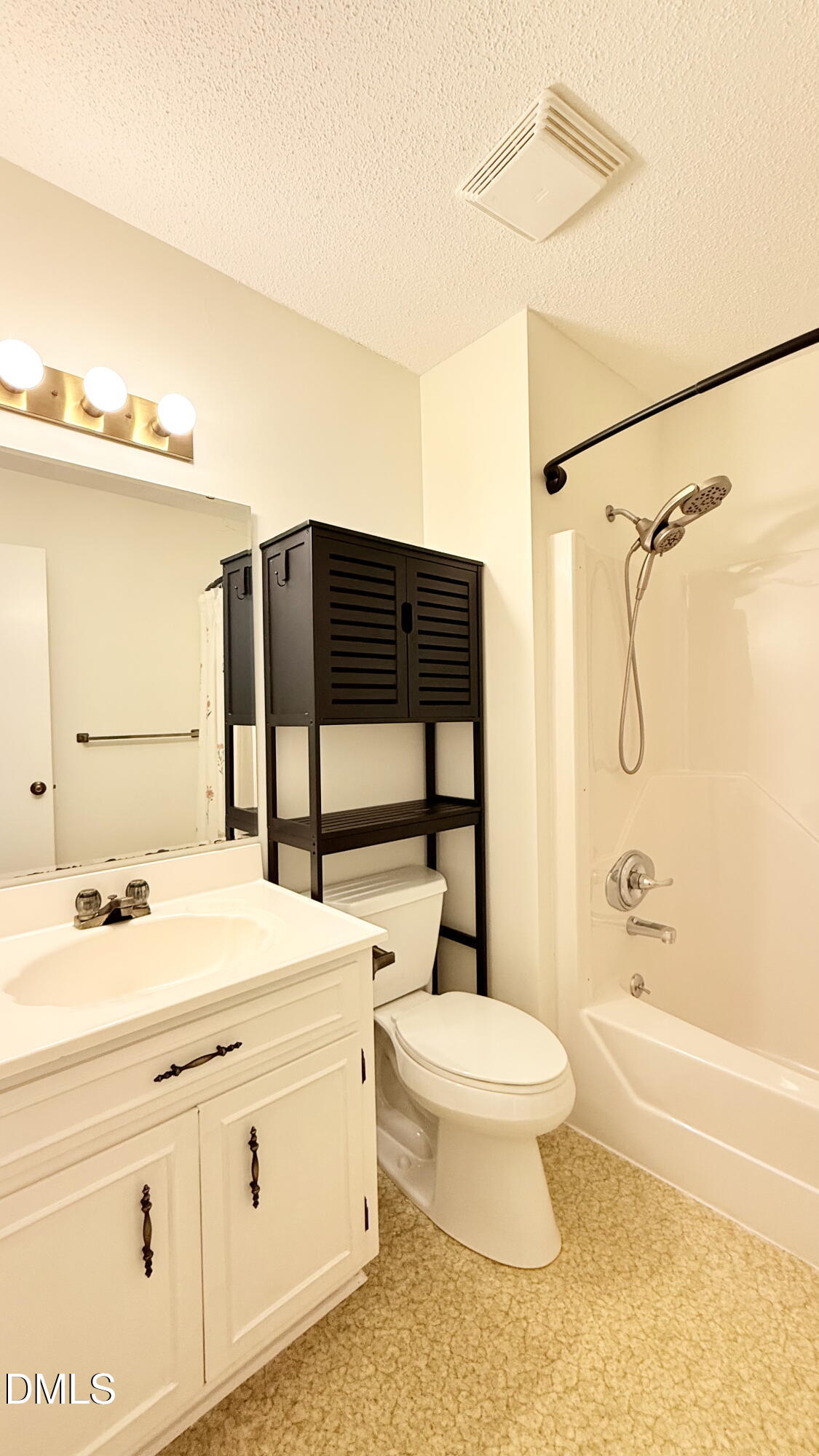 702 Delmar Road Cary, NC 27511 - Photo 21 of 23 a bathroom with a sink toilet vanity and shower