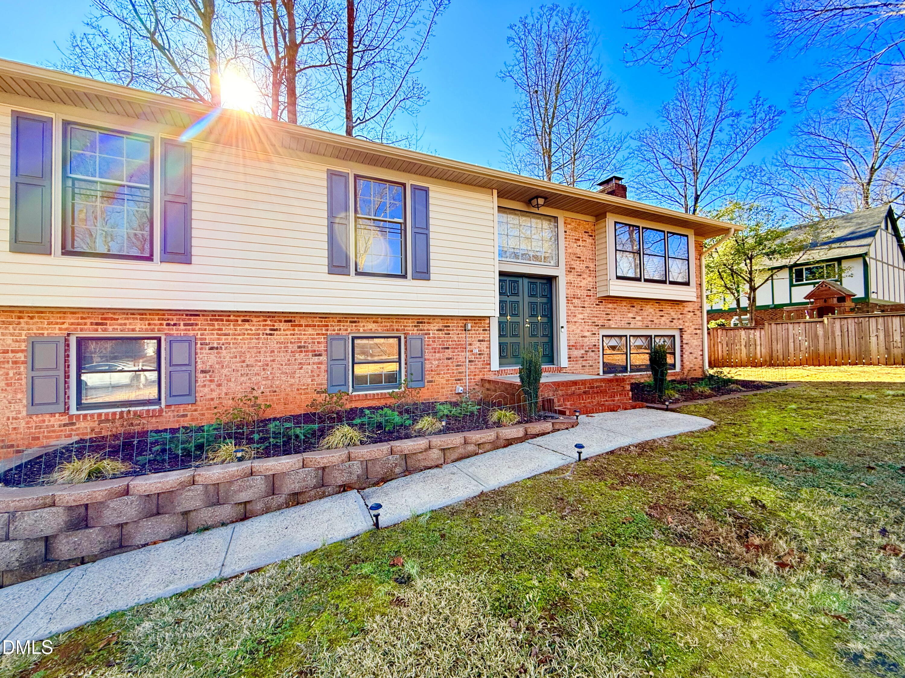 702 Delmar Road Cary, NC 27511 - Photo 3 of 23 a front view of a house with a yard and outdoor seating