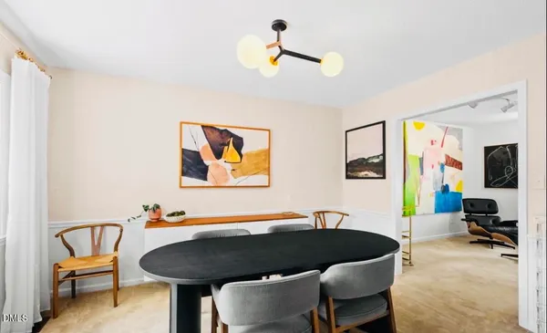 a living room with furniture and a piano