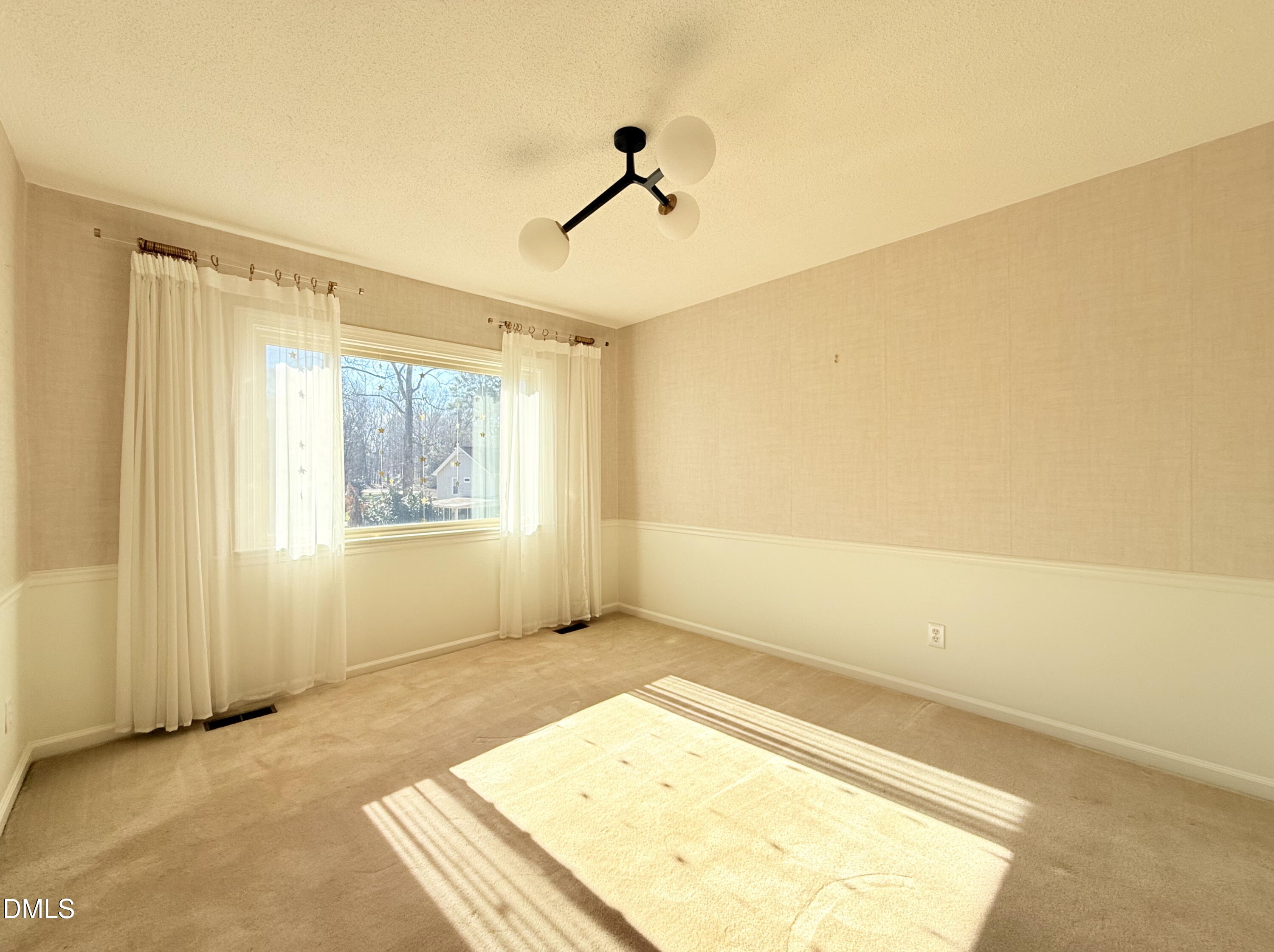 702 Delmar Road Cary, NC 27511 - Photo 9 of 23 a view of an empty room and window