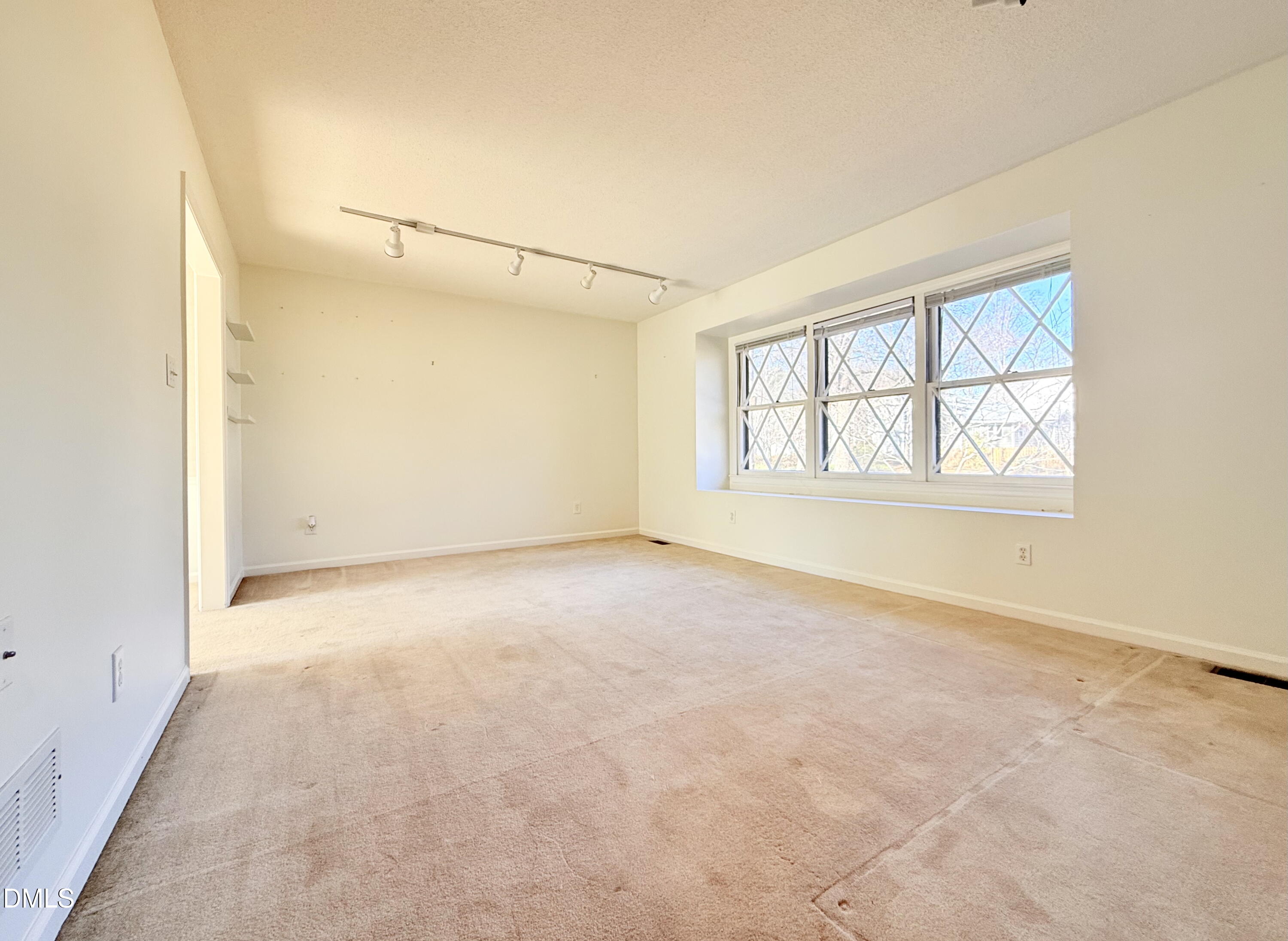 702 Delmar Road Cary, NC 27511 - Photo 10 of 23 an empty room with windows and closet